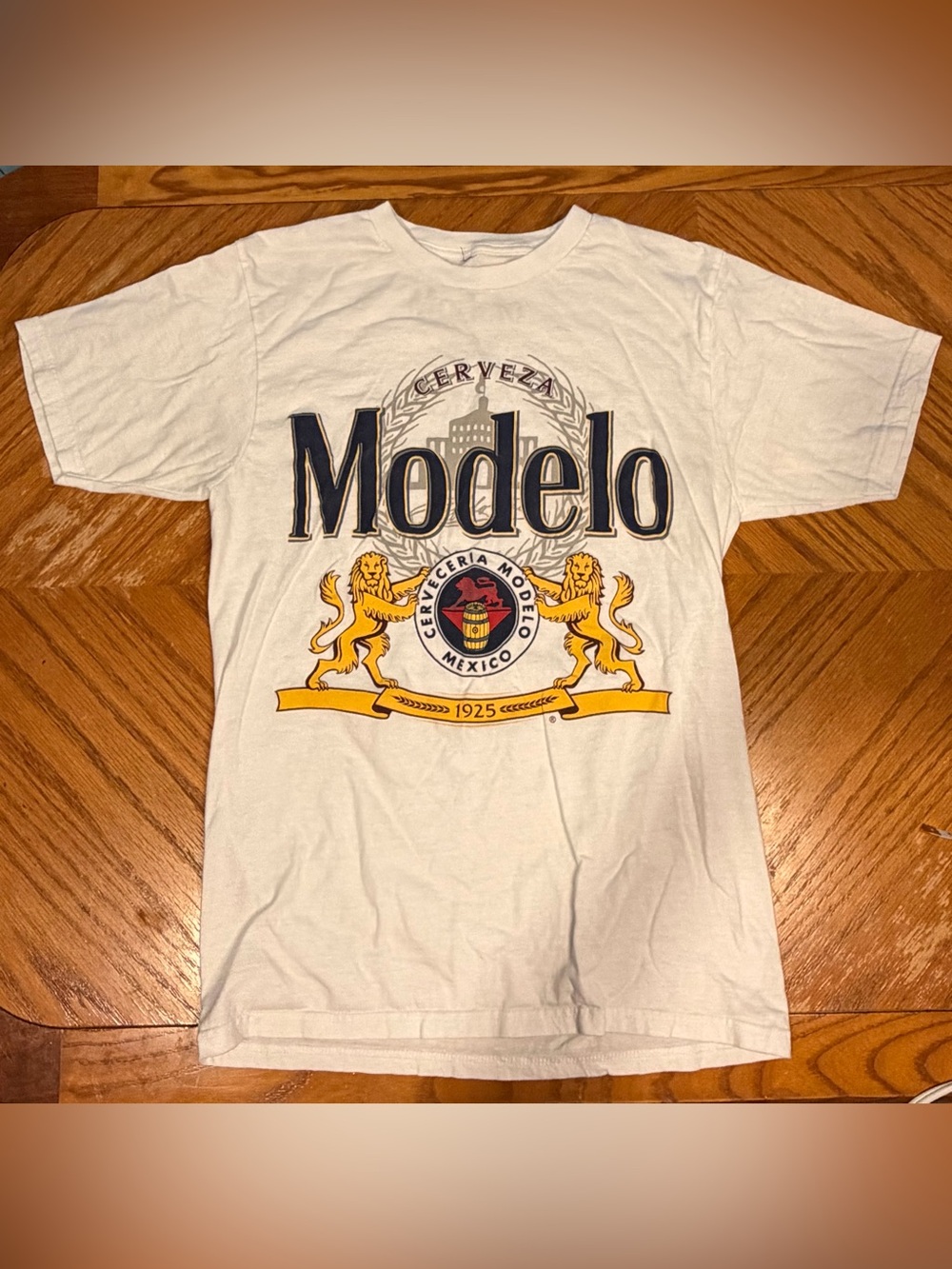 ModelCo White T-Shirt with Navy and Gold Crest Graphic